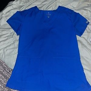 Blue Medicare scrub top with pockets